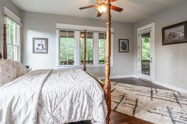 a spacious bedroom with a large bed and a window