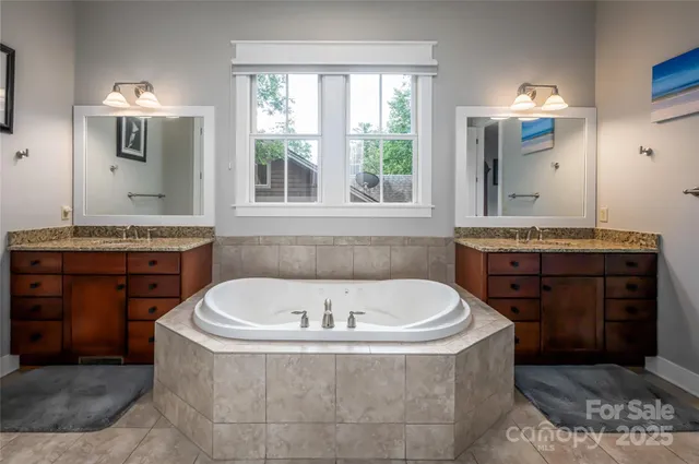 a bath tub sitting in a bathroom next to a window