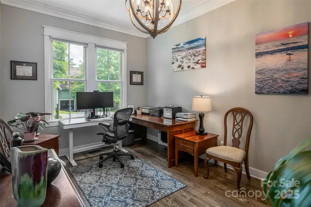 a work room with furniture and a window