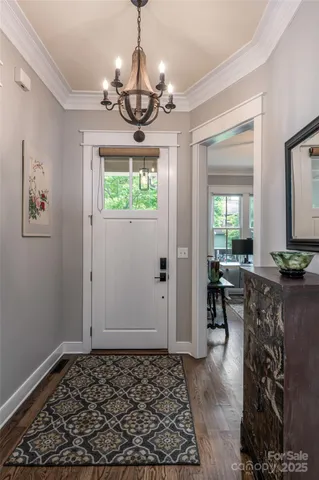 a view of a livingroom with furniture window and wooden floor