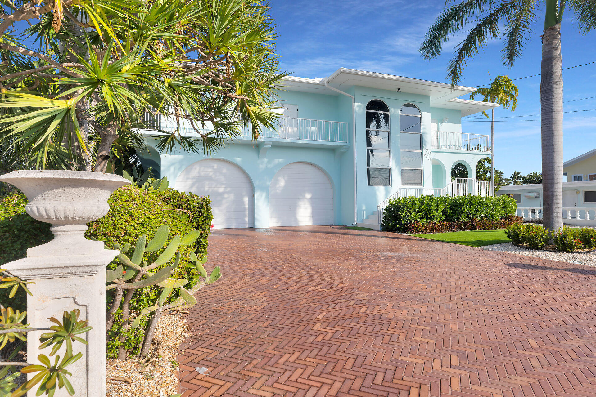 580-590 10th Street Key Colony Beach, FL 33051 - Photo 66 of 75 a front view of a house with a yard and fountain