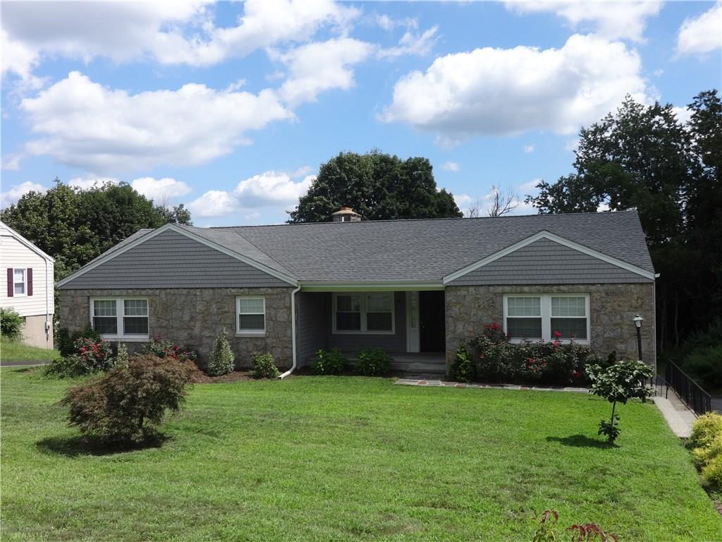 64 Calhoun Avenue Trumbull, CT 06611 - Photo 1 of 1 a front view of a house with a garden