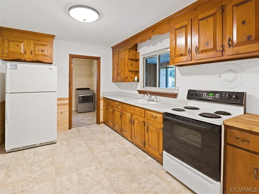906 Pierpont Road Richmond, VA 23225 - Photo 12 of 24 a kitchen with stainless steel appliances granite countertop a stove a refrigerator and a refrigerator