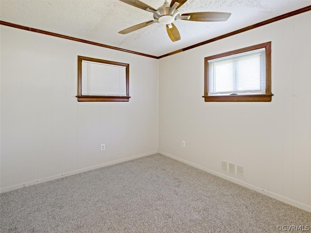 906 Pierpont Road Richmond, VA 23225 - Photo 15 of 24 an empty room with a window and a fan