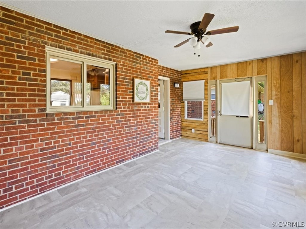 906 Pierpont Road Richmond, VA 23225 - Photo 21 of 24 a view of an empty room with a ceiling fan and window