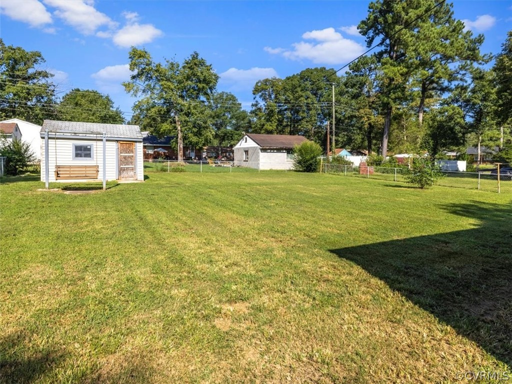 906 Pierpont Road Richmond, VA 23225 - Photo 22 of 24 a front view of a house with a yard