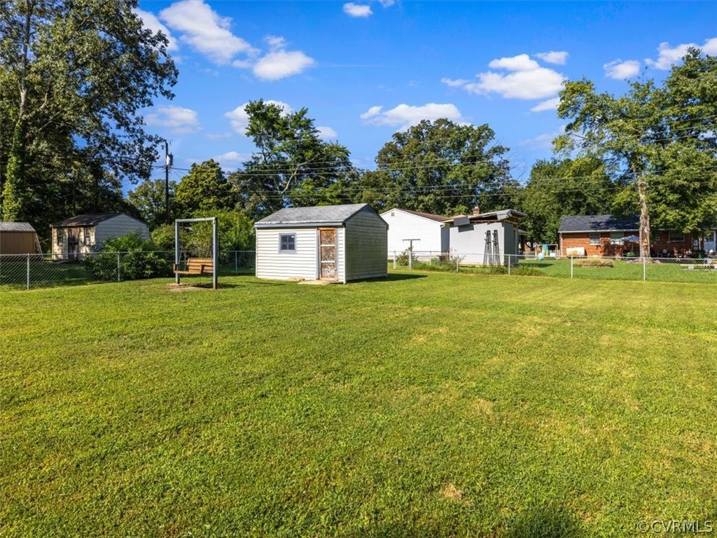 906 Pierpont Road Richmond, VA 23225 - Photo 23 of 24 a house view with swimming pool and trees in the background