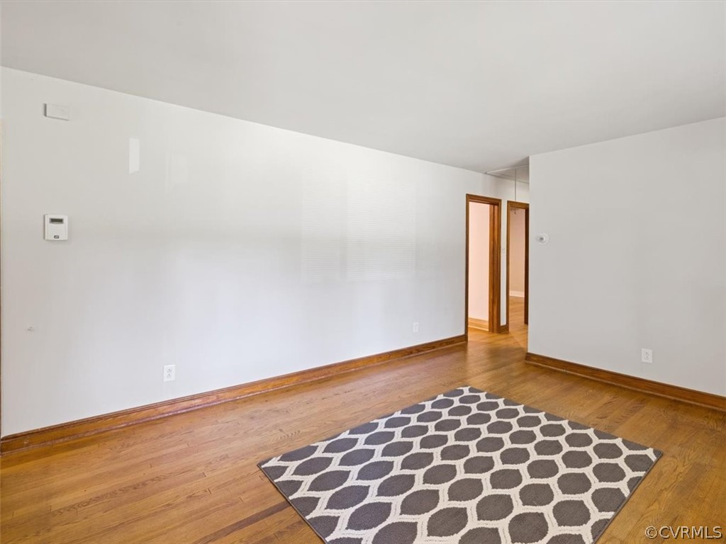 906 Pierpont Road Richmond, VA 23225 - Photo 6 of 24 an empty room with wooden floor
