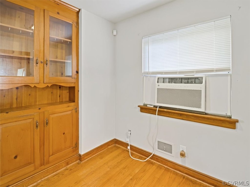 906 Pierpont Road Richmond, VA 23225 - Photo 7 of 24 a view of a room with wooden floor and cabinet