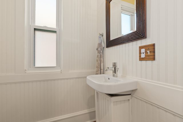 7009 34th Street Berwyn, IL 60402 - Photo 15 of 30 a bathroom with a sink and a mirror