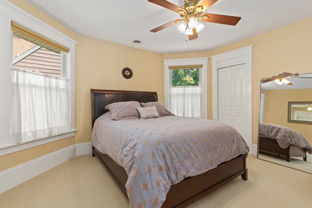 7009 34th Street Berwyn, IL 60402 - Photo 19 of 30 a bedroom with a bed and window