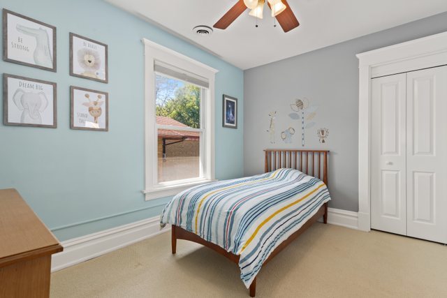 7009 34th Street Berwyn, IL 60402 - Photo 20 of 30 a bedroom with a bed and a window