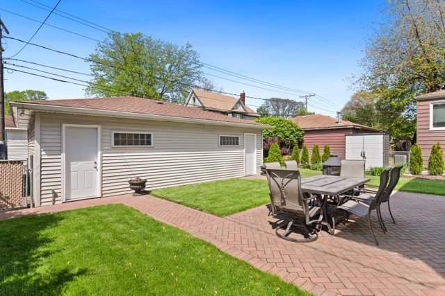 7009 34th Street Berwyn, IL 60402 - Photo 24 of 30 a view of a house with patio and a yard