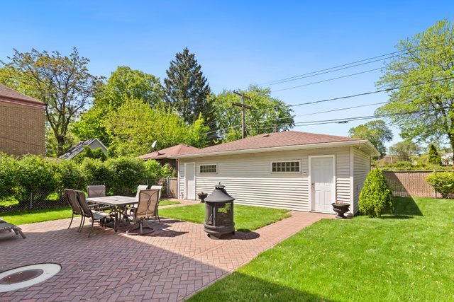 7009 34th Street Berwyn, IL 60402 - Photo 25 of 30 a view of a house with backyard and sitting area