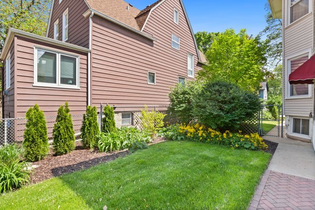 7009 34th Street Berwyn, IL 60402 - Photo 27 of 30 a front view of a house with a garden