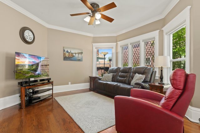 7009 34th Street Berwyn, IL 60402 - Photo 8 of 30 a living room with furniture and a flat screen tv