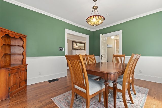 7009 34th Street Berwyn, IL 60402 - Photo 9 of 30 a view of a dining room with furniture and wooden floor
