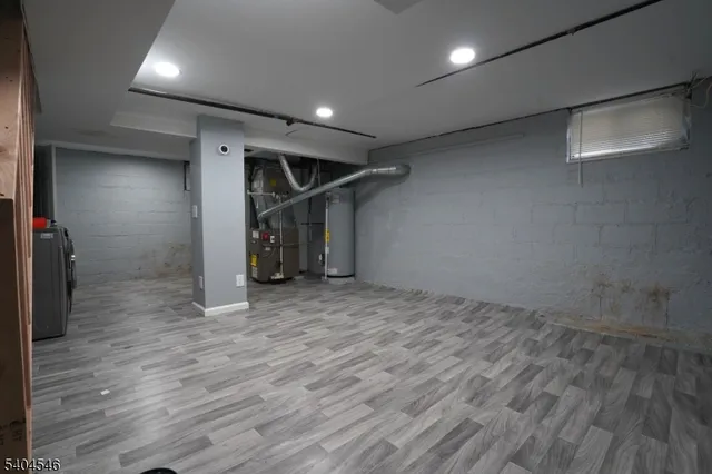 an empty room with wooden floor and closet