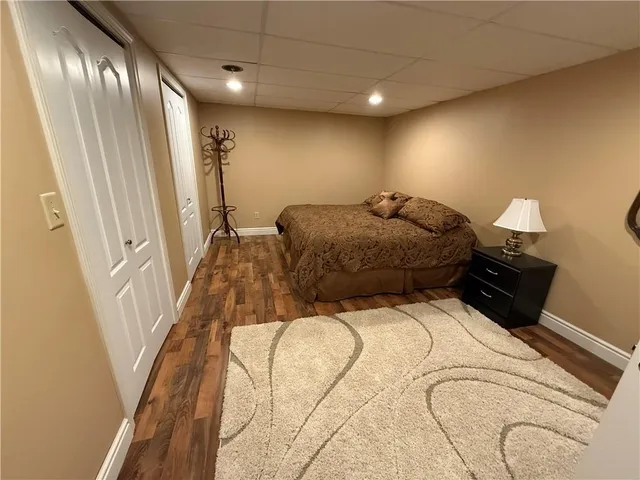 a bed room with a bed window and a couch
