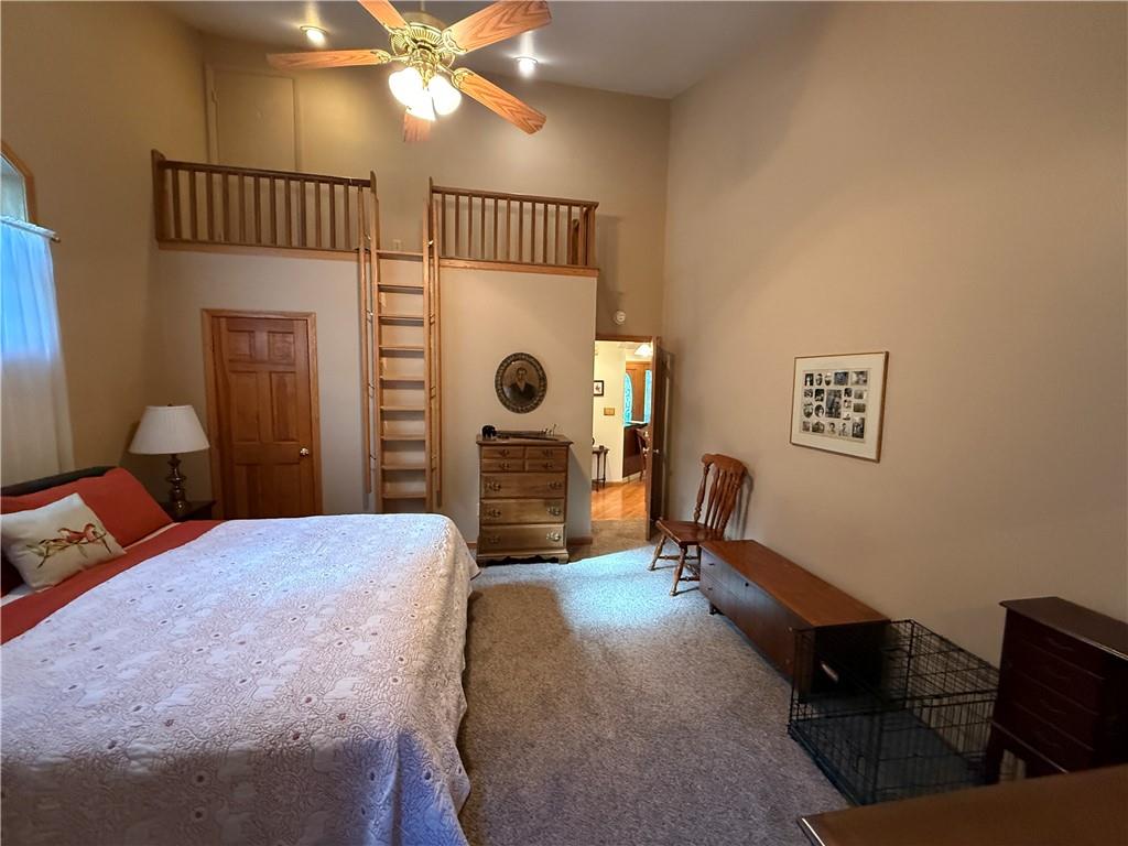 181 View Street Indiana, PA 15701 - Photo 28 of 34 a bedroom with a bed and a chandelier