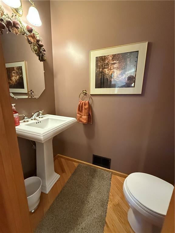 181 View Street Indiana, PA 15701 - Photo 32 of 34 a bathroom with a toilet a sink and mirror