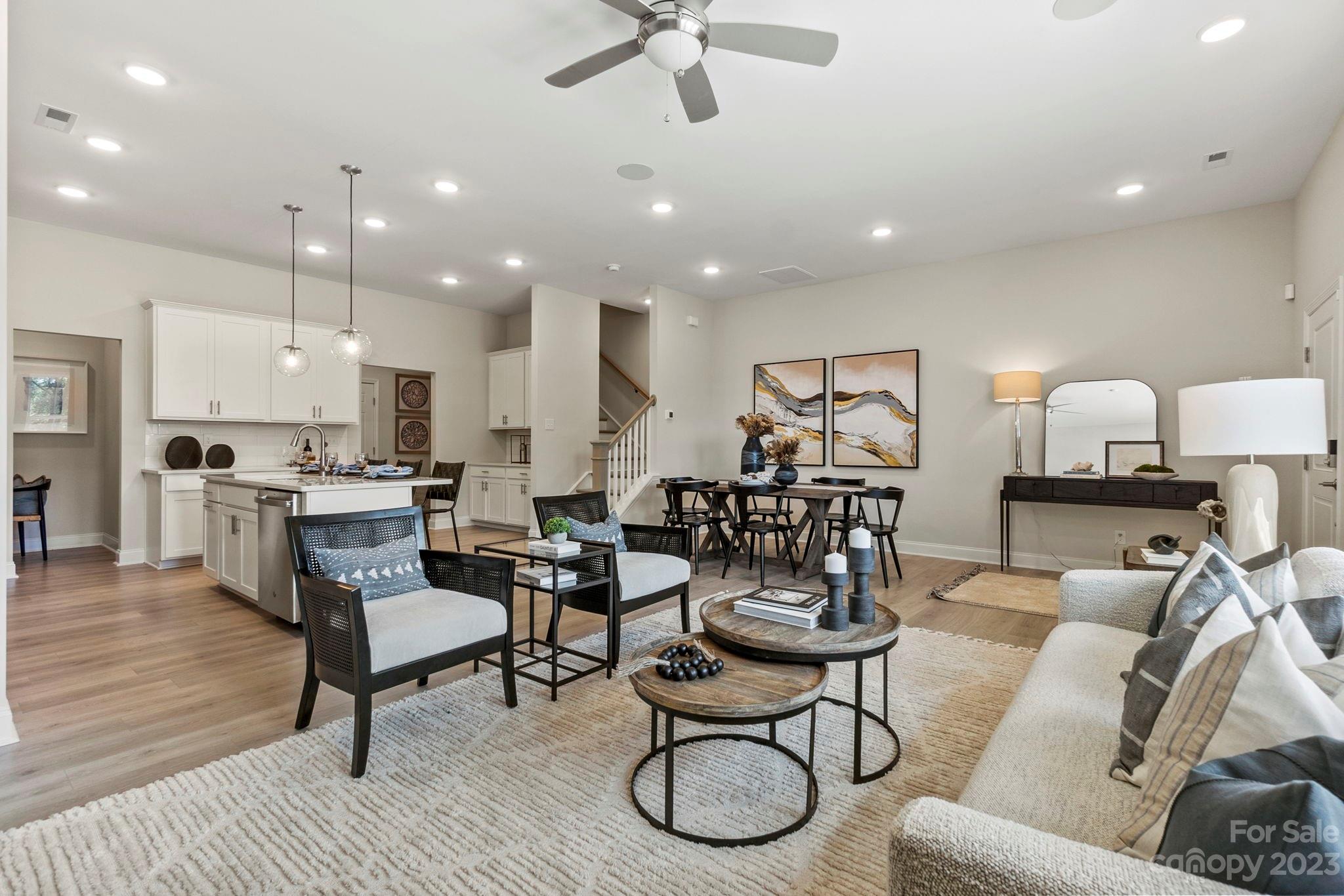 8915 Winding Waters Road Harrisburg, NC 28215 - Photo 11 of 30 a living room with furniture and kitchen view