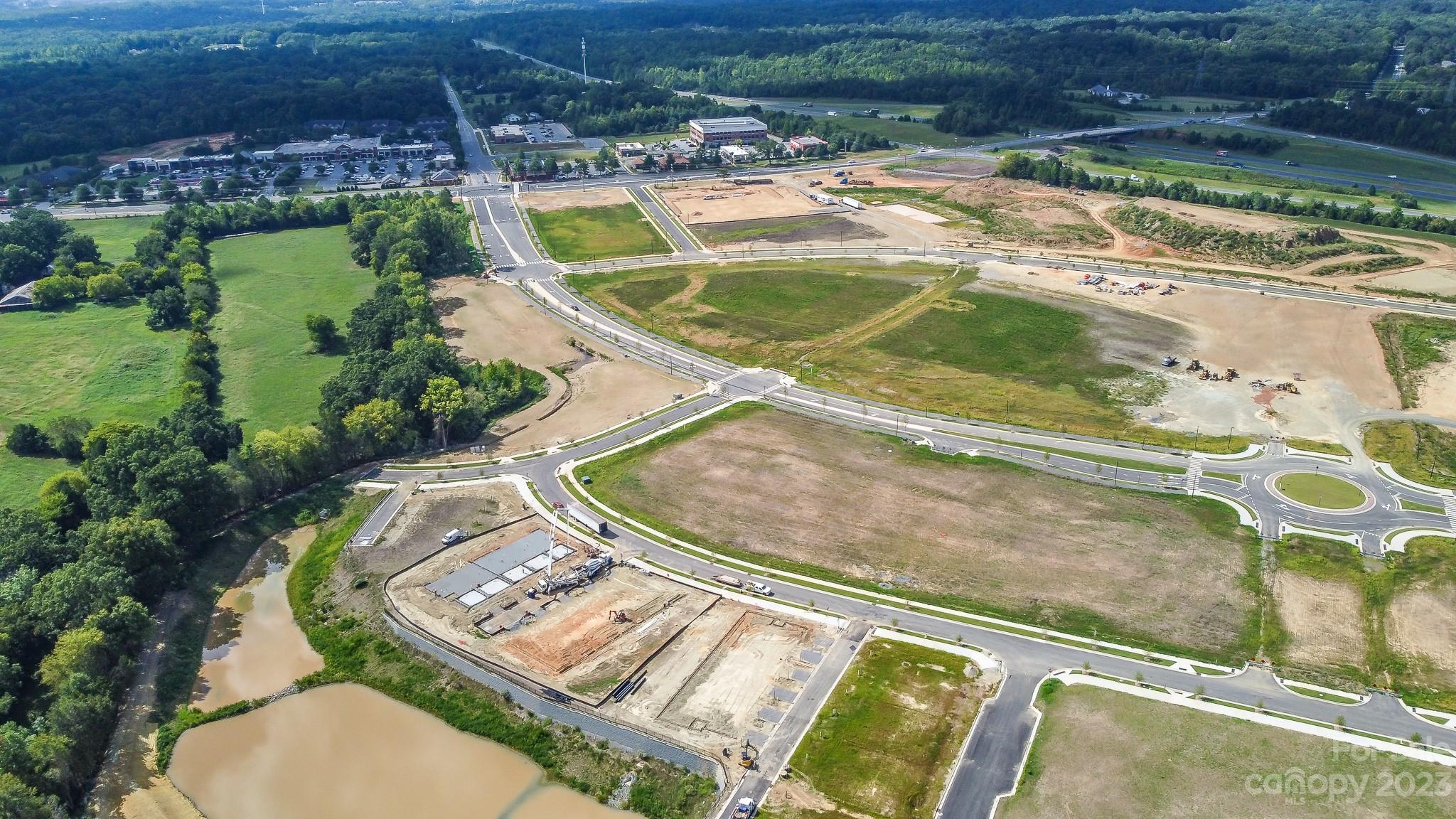 8915 Winding Waters Road Harrisburg, NC 28215 - Photo 29 of 30 an aerial view of a house with a swimming pool