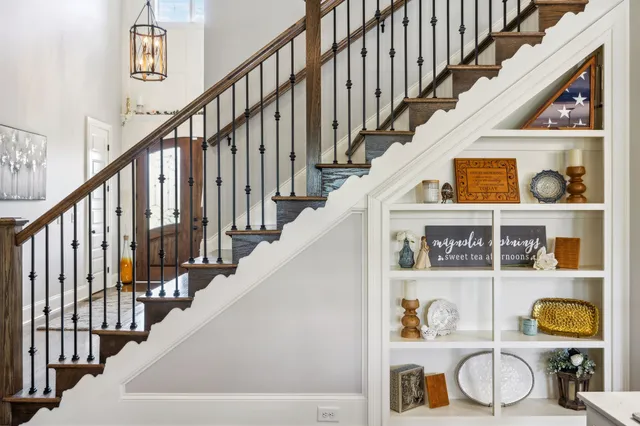 a kitchen with stainless steel appliances granite countertop a lot of counter space and wooden floors