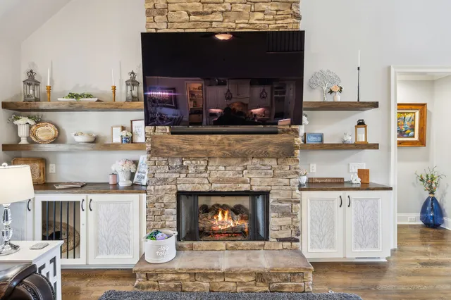 a front view of a house with a yard and trees