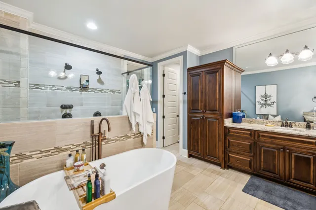 a bedroom with furniture and a window