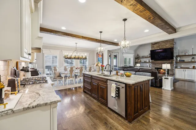 a living room with lots of furniture and a rug