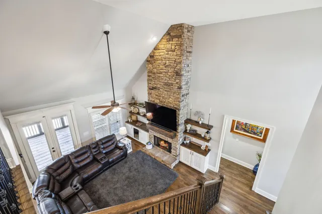 a view of a patio with table and chairs potted plants with wooden fence