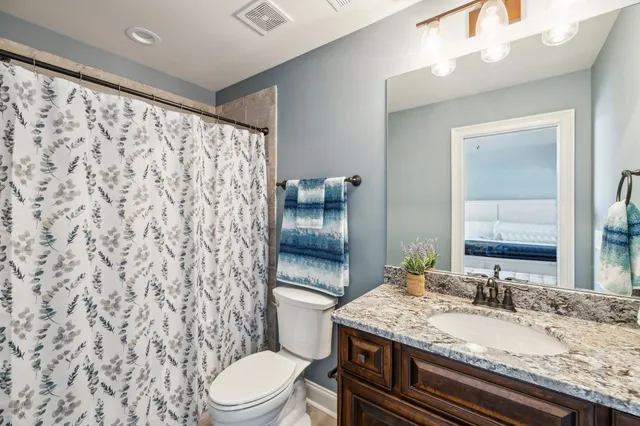 a view of a house with backyard porch and sitting area