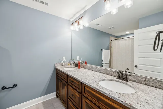 a bathroom with a toilet and a sink