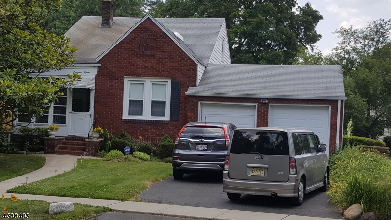 a car parked in front of a house