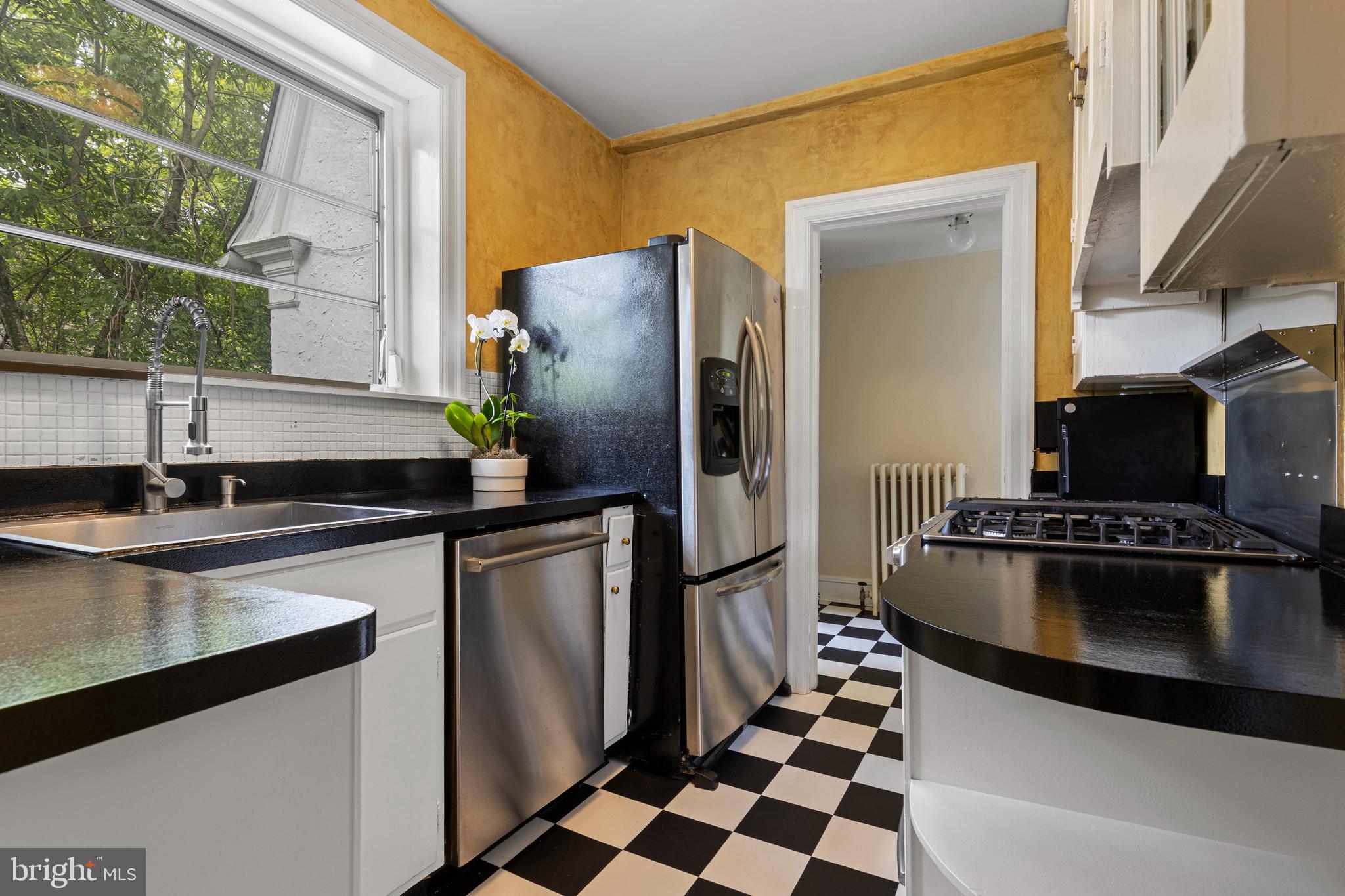 60 Old Eagle School Road Wayne, PA 19087 - Photo 14 of 43 a kitchen with stainless steel appliances granite countertop a sink stove and refrigerator