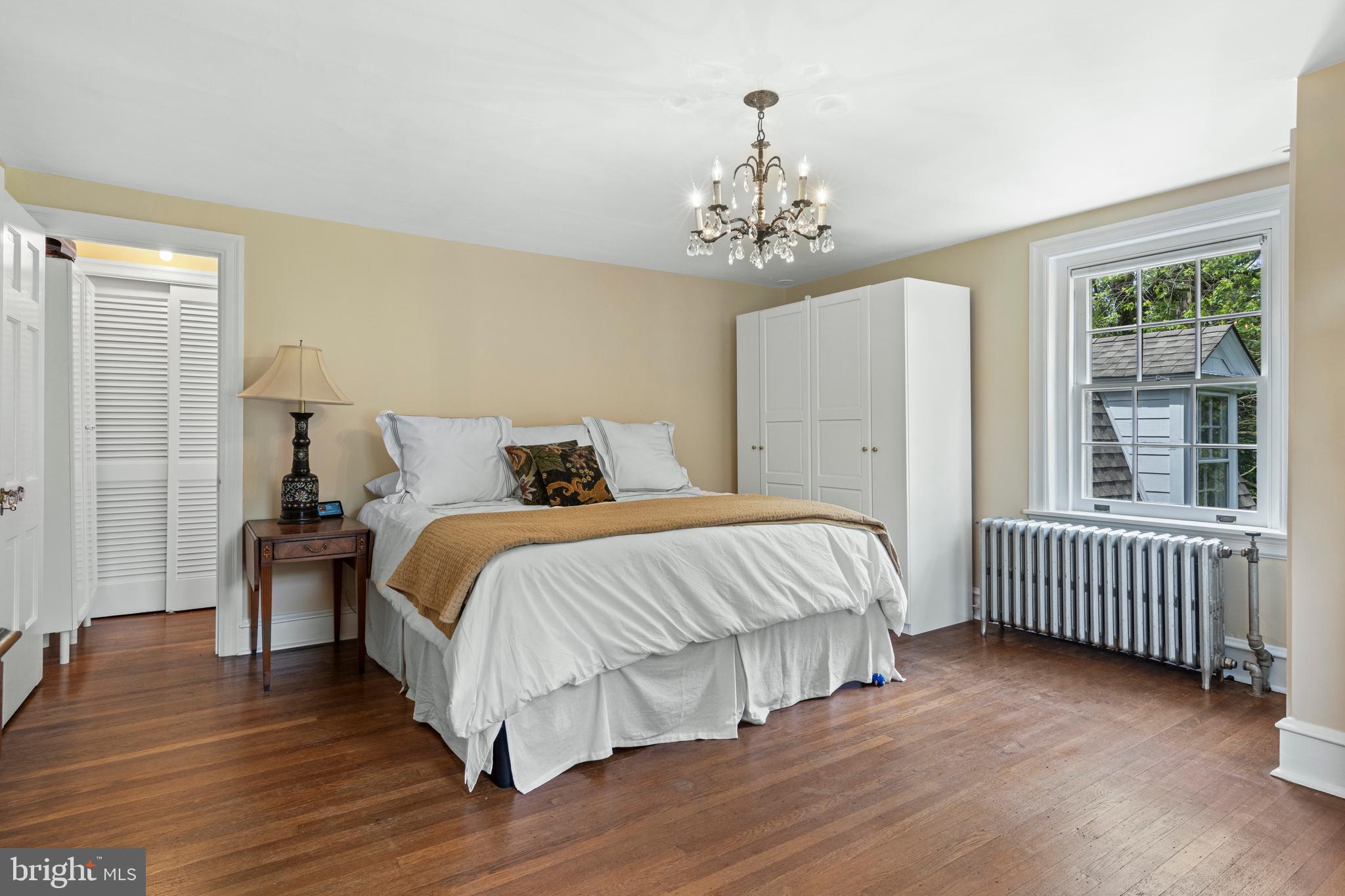 60 Old Eagle School Road Wayne, PA 19087 - Photo 18 of 43 a bed sitting in a spacious bedroom next to a window