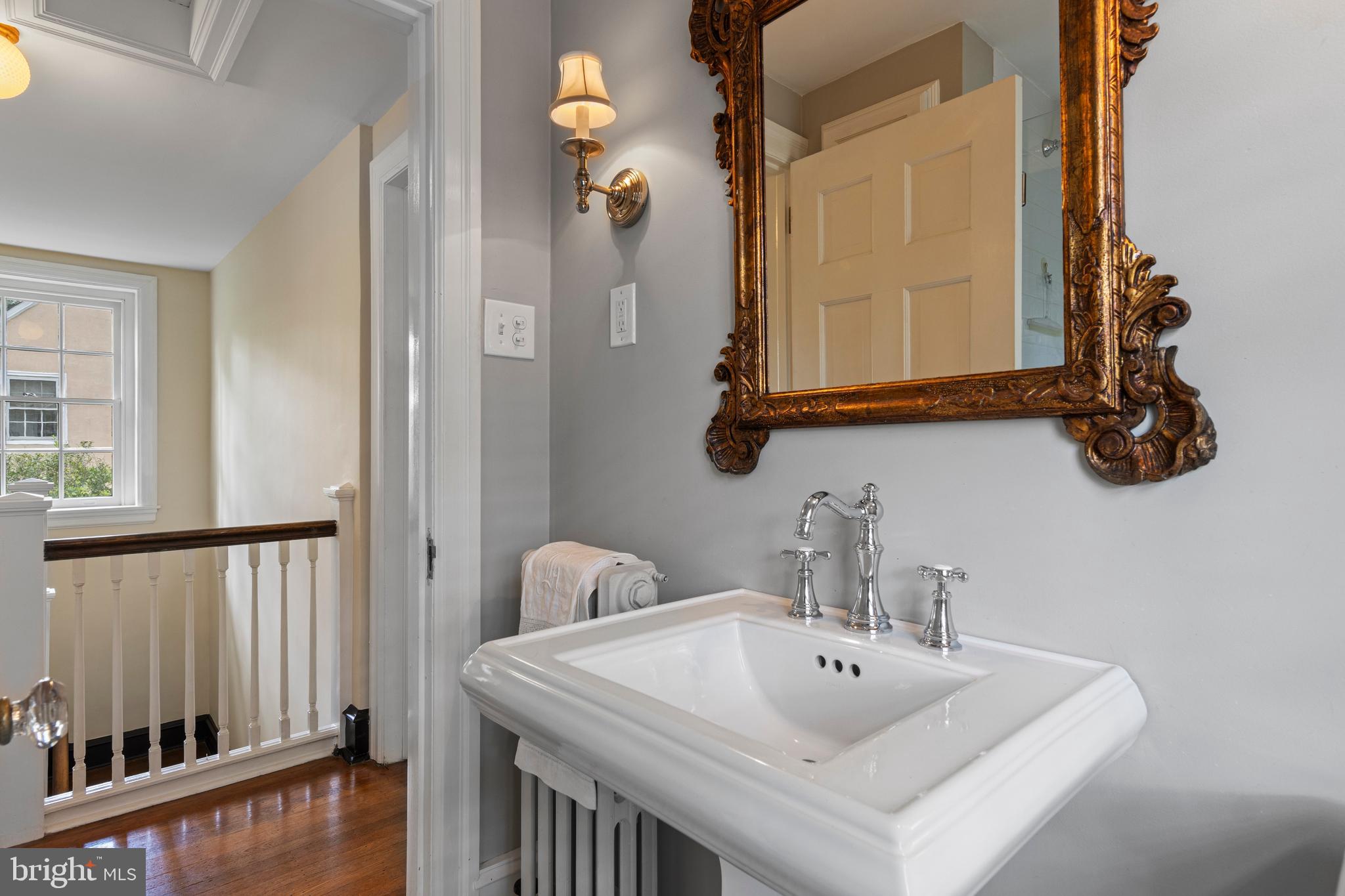 60 Old Eagle School Road Wayne, PA 19087 - Photo 23 of 43 a bathroom with a sink and a mirror