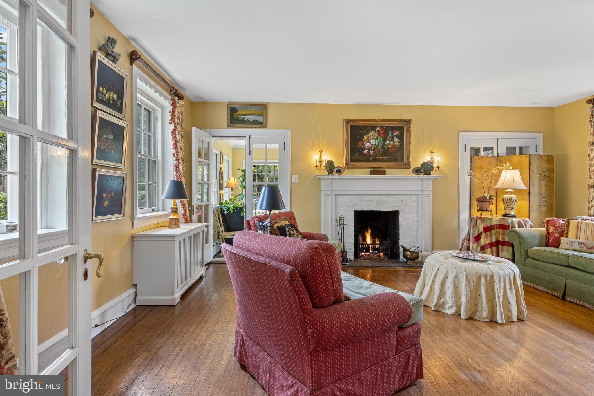 60 Old Eagle School Road Wayne, PA 19087 - Photo 5 of 43 a living room with furniture a fireplace and a large window