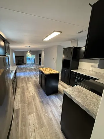a kitchen with sink and cabinets