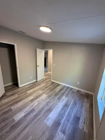a view of a livingroom with wooden floor