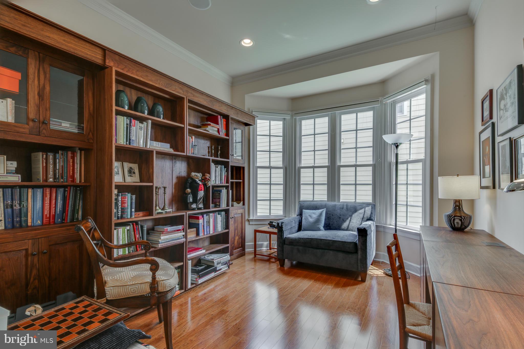 7706 Elmwood Road Fulton, MD 20759 - Photo 9 of 30 a living room with furniture and a book shelf