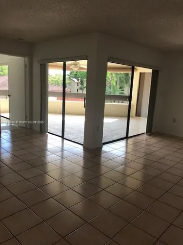 an empty room with large window