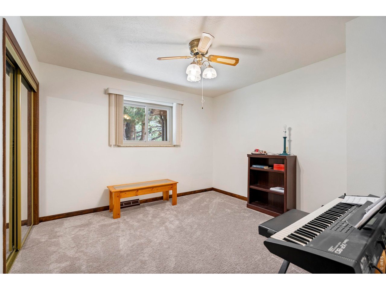 300 Ranch Acres Drive Loveland, CO 80538 - Photo 21 of 38 a living room with furniture and a piano