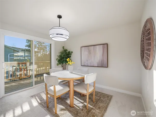 a dining room with furniture and window