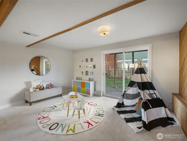 a living room with furniture and a table