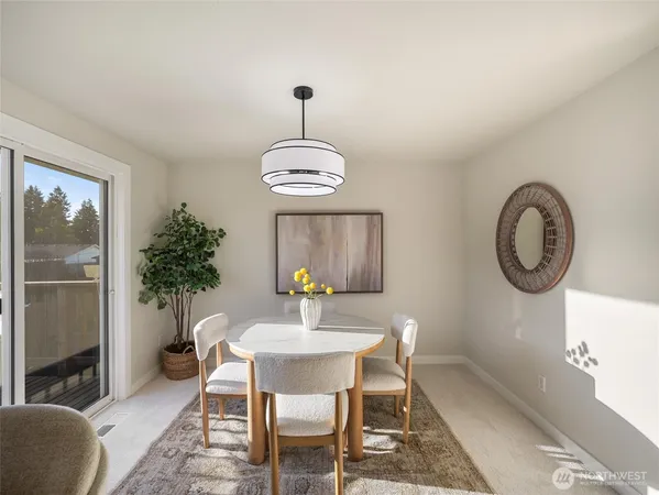 a dining room with furniture and window
