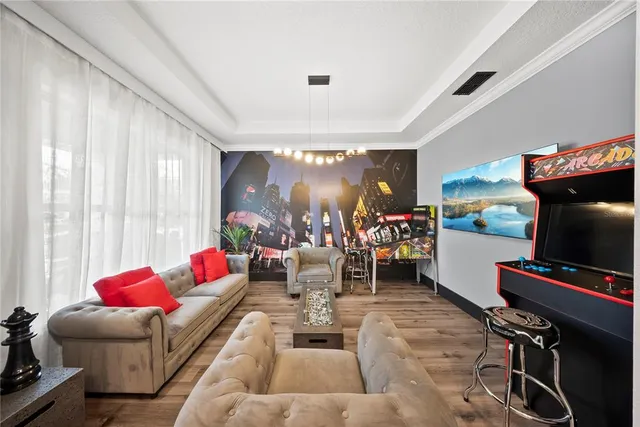 a living room with furniture and a flat screen tv