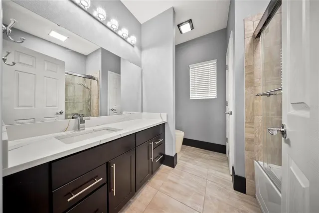 a bed room with a bed and a television