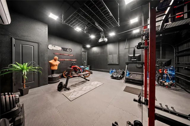 a view of a studio with wooden floor